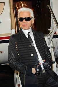 Karl Lagerfeld in front of the plane